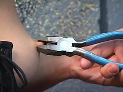 Beautiful young girl roughly a bdsm corset is whipped forth pliers
